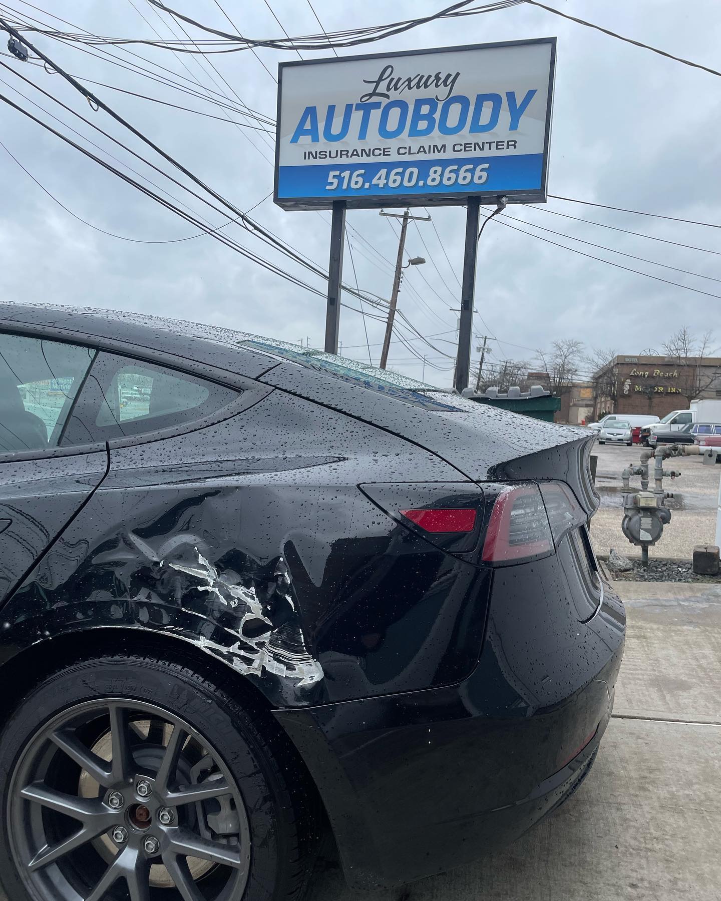 Tesla Model 3 rear quarter before repair with collision damage